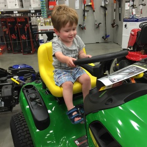 Hanging out at Lowes while waiting to meet Bennett. Owen really loved the riding lawn mowers.
